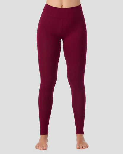 A lady wearing Softwear With Stretch High Waist Legging in scarlet posing in a front view position