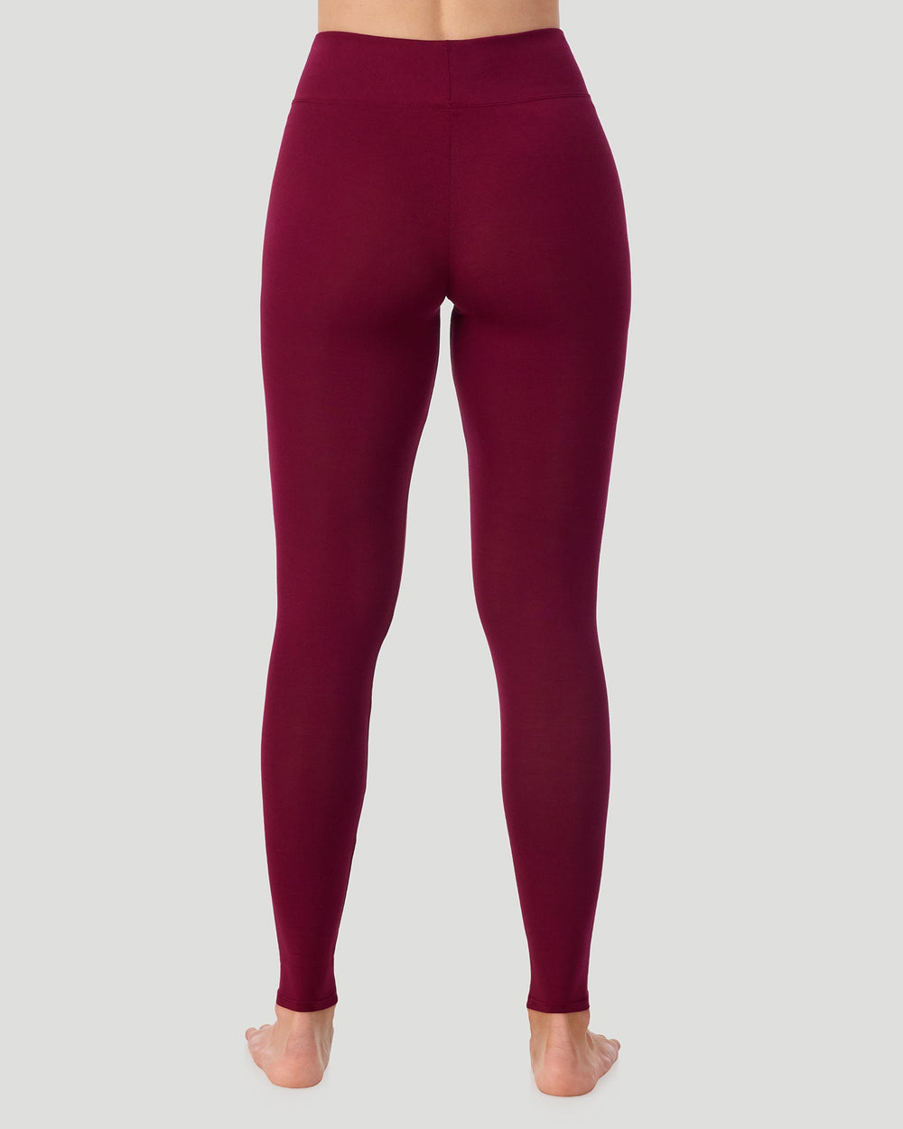 A lady wearing Softwear With Stretch High Waist Legging in scarlet in a back view pose