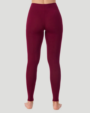 A lady wearing Softwear With Stretch High Waist Legging in scarlet in a back view pose