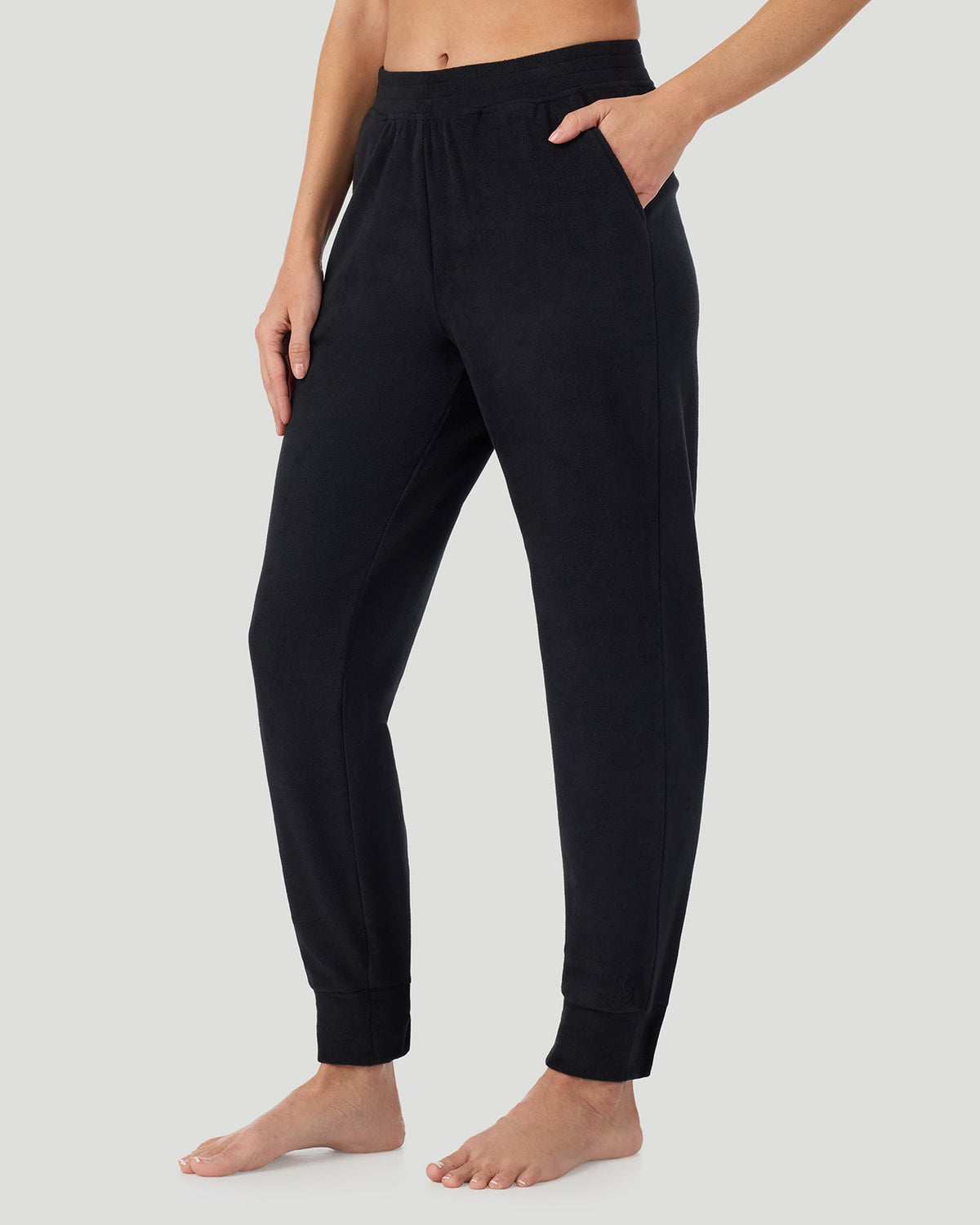 A lady wearing Black Fleecewear With Stretch Jogger in a front view side angle pose