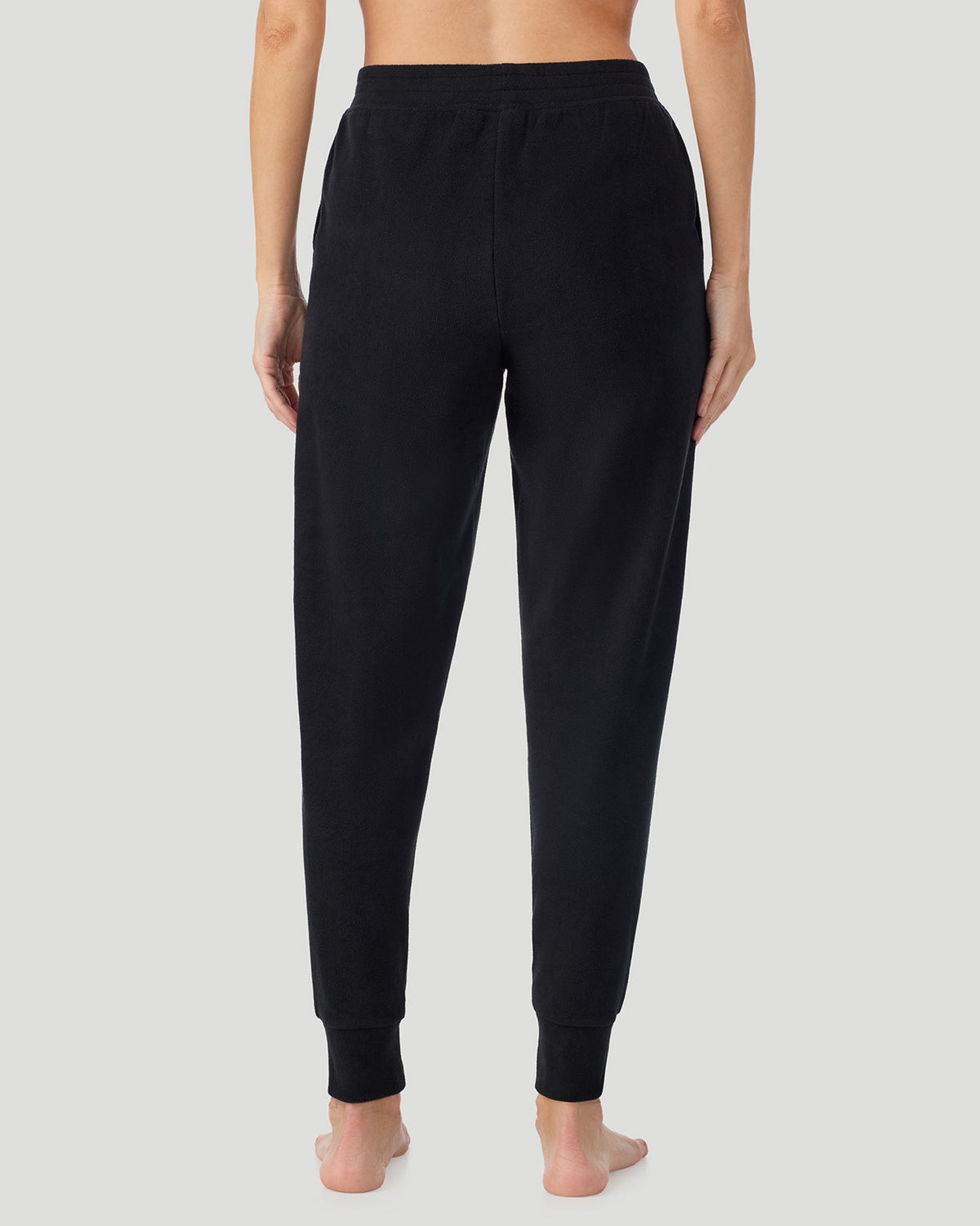 Black; Model is wearing a size S. She is 5’9”, Bust 34.5”, Waist 25”, Hips 36.5”. @A lady wearing Black Fleecewear With Stretch Jogger in a back view pose