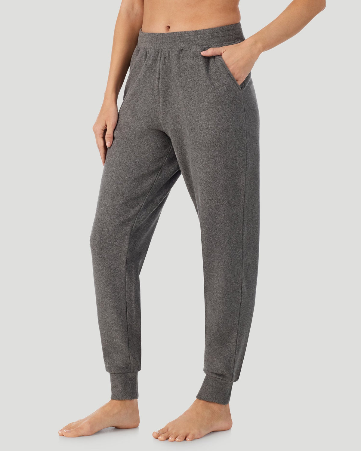 A lady wearing Charcoal Heather Fleecewear With Stretch Jogger in a front view side angle pose