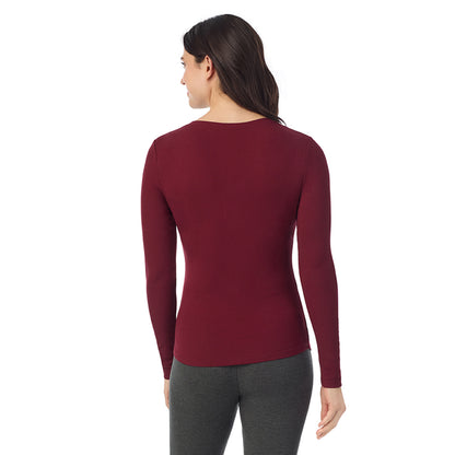 Cabernet; Model is wearing a size S. She is 5’9”, Bust 34”, Waist 25”, Hips 36”@ A lady is wearing a Cabernet Stretch Rib Long Sleeve Henley