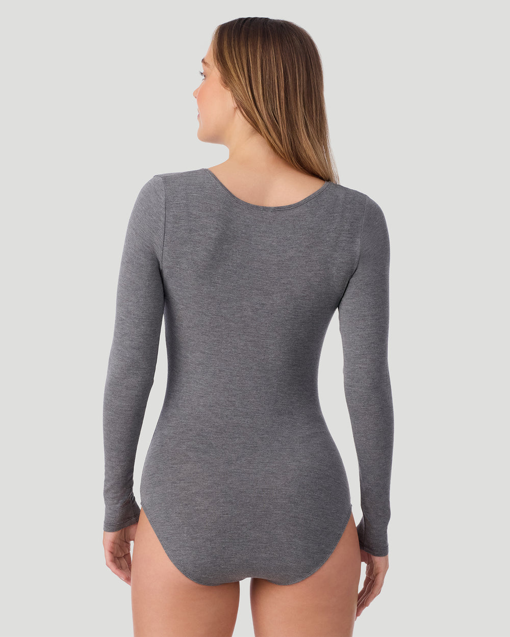 A lady wearing Softwear With Stretch Long Sleeve Bodysuit in charcoal heather shown in a back view pose