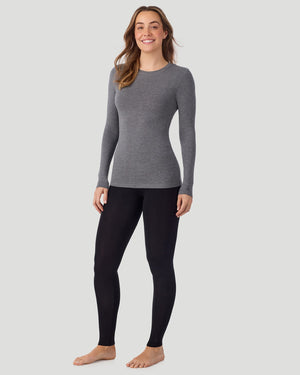 A lady is wearing Softwear with Stretch Crew Neck Tank with Lace