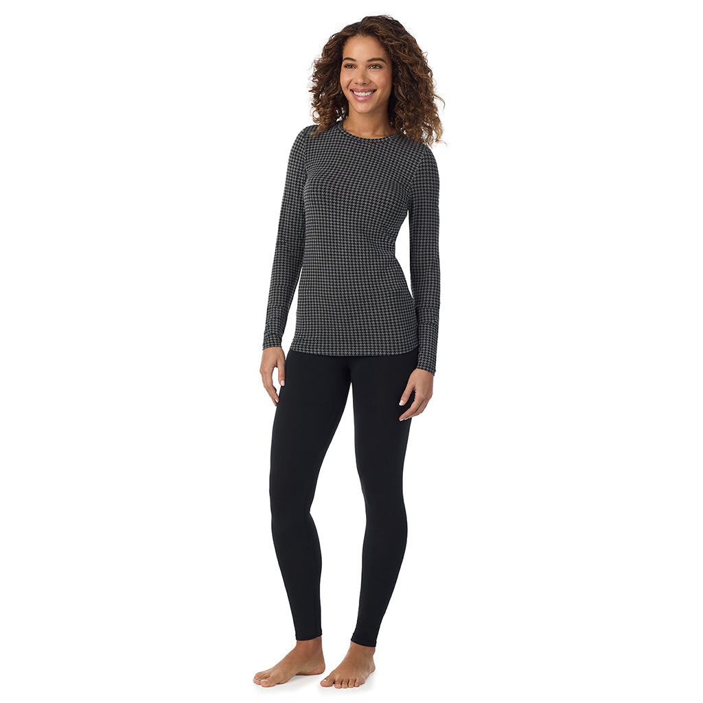 A lady wearing charcoal heather houndsooth long sleeve crew petite softwear with stretch top.