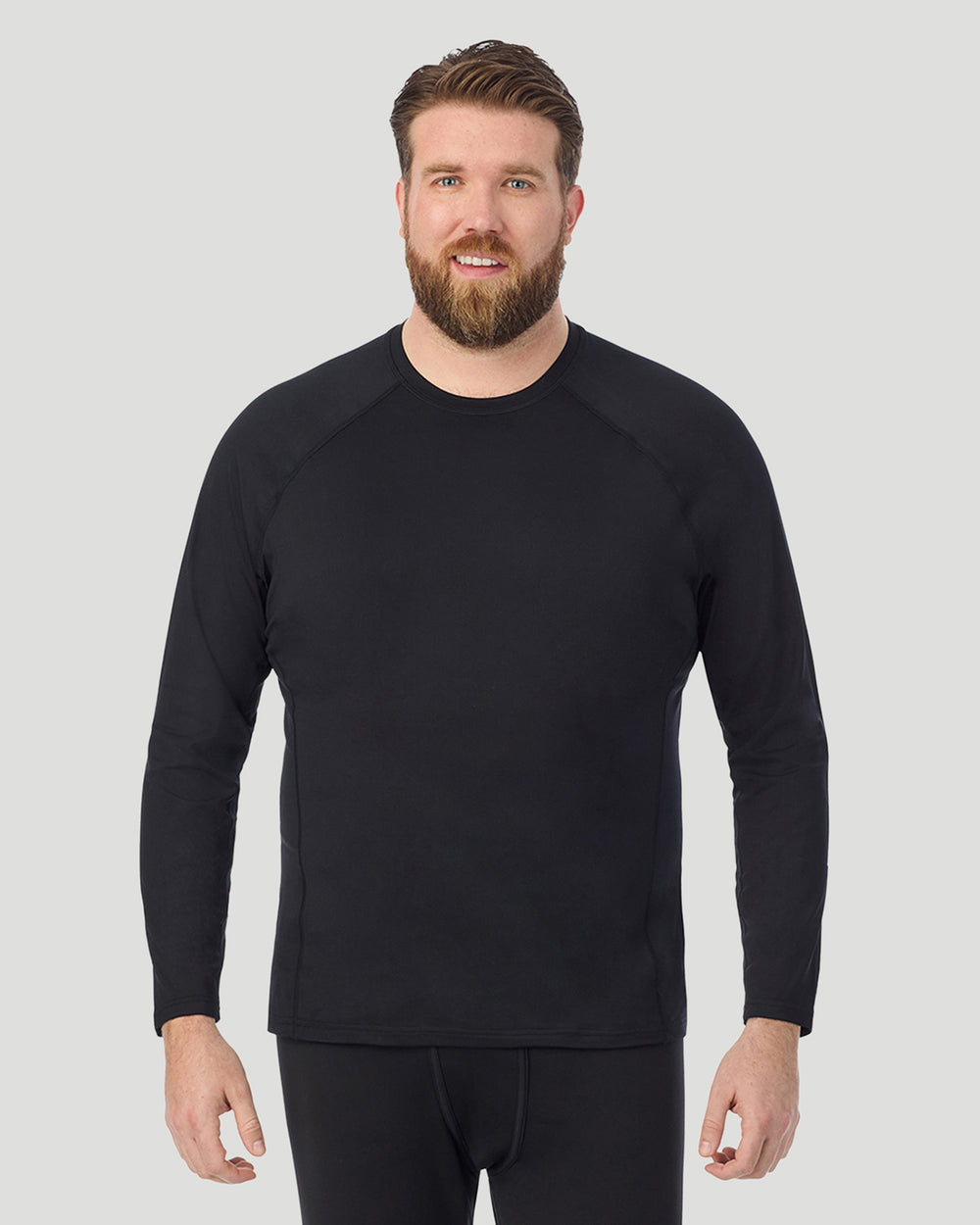 A man wearing Black ArctiCore Long Sleeve Crew Big & Tall in a front view pose
