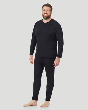  A man wearing Black ArctiCore Long Sleeve Crew Big & Tall in a front view standing pose