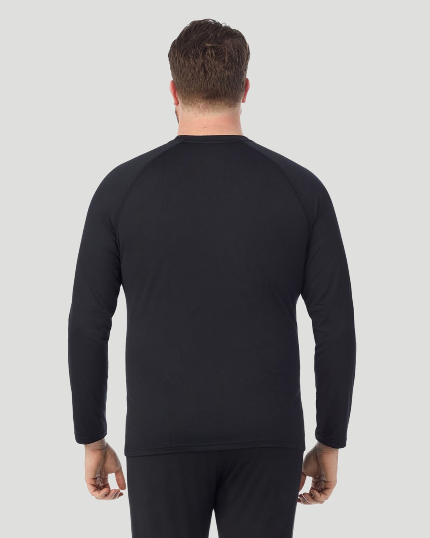 Black; Model is wearing a size XXL. He is 6’6”, Waist is 32”, Inseam 35”. @ A man wearing Black ArctiCore Long Sleeve Crew Big & Tall in a front view pose