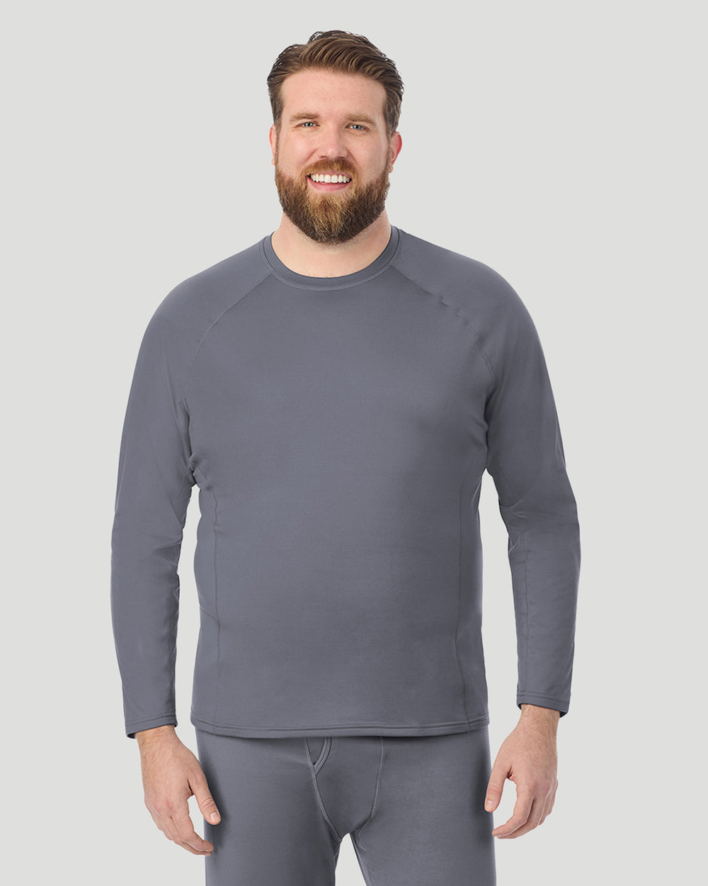 A man wearing Nickel Grey ArctiCore Long Sleeve Crew Big & Tall in a front view pose