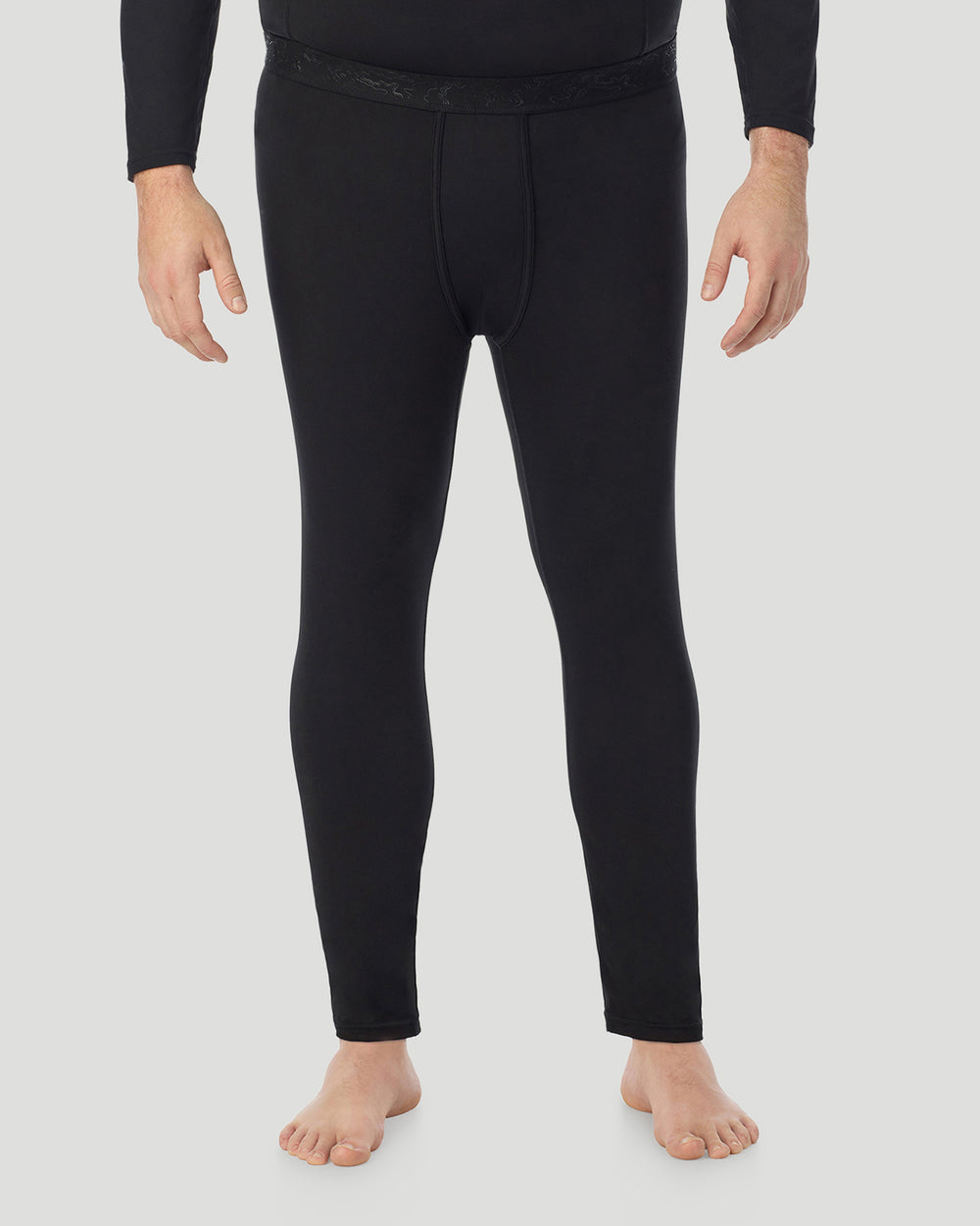 Lower body of a man wearing black pants