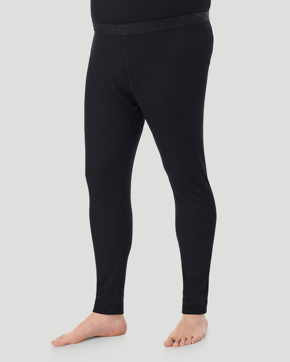 A man wearing Black Waffle Thermal Pant Big & Tall in a front view side angle pose