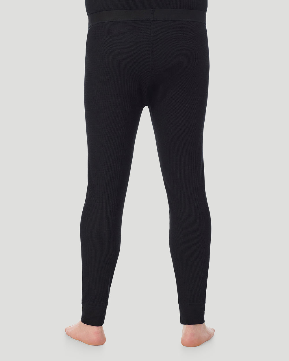 A man wearing Black Waffle Thermal Pant Big & Tall in a back view pose