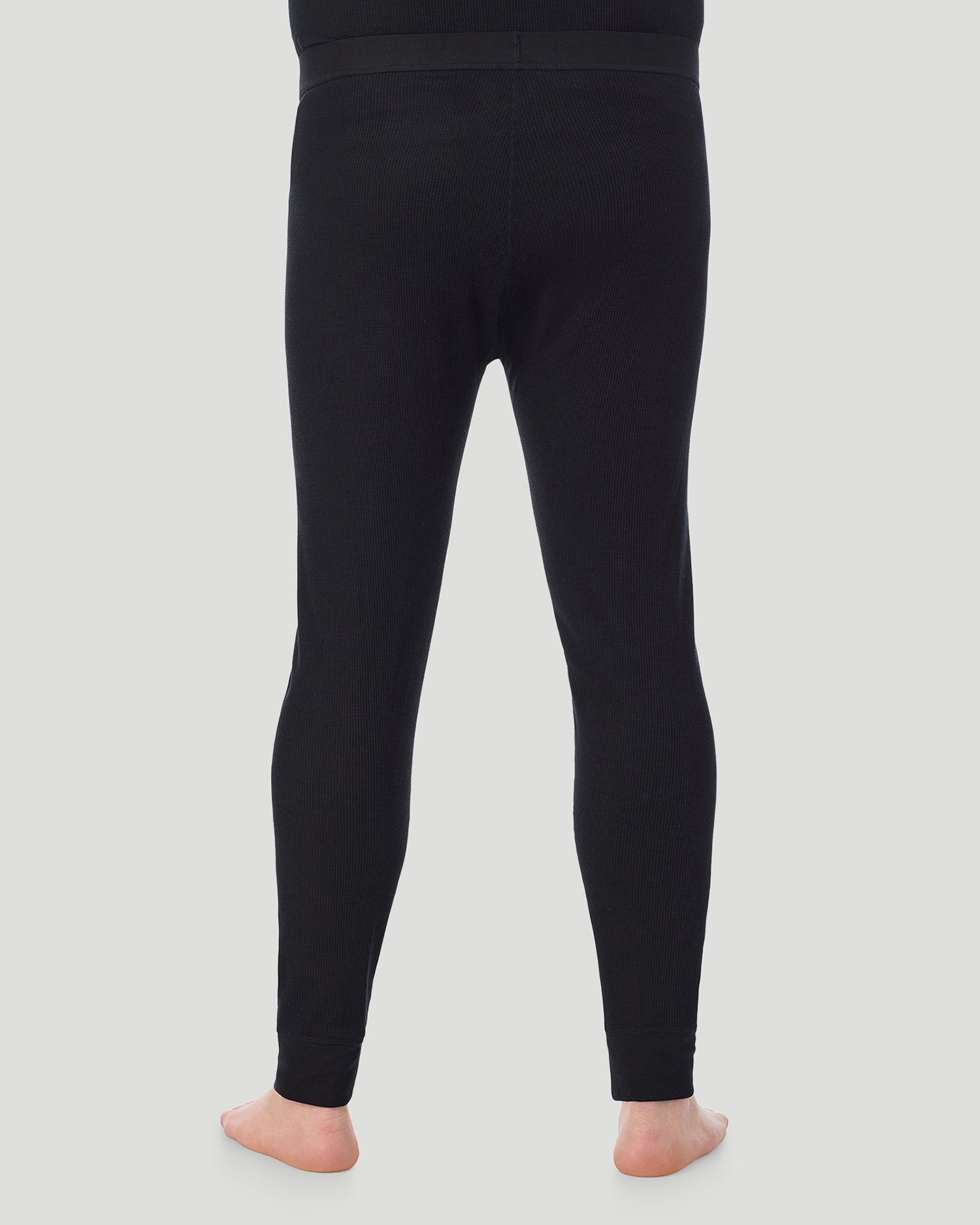 Black; Model is wearing a size XXL. He is 6’6”, Waist is 32”, Inseam 35”. @ A man wearing Black Waffle Thermal Pant Big & Tall in a front view pose