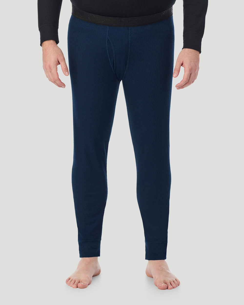 A man wearing Navy Blazer Waffle Thermal Pant Big & Tall in a front view pose