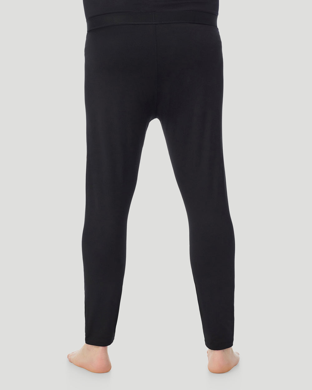 A man wearing Black ArctiCore Pant Big & Tall in a back view pose