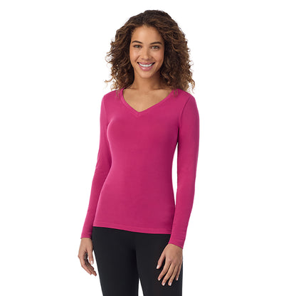 Deep Fuchsia; Model is wearing size S. She is 5’9”, Bust 34”, Waist 23”, Hips 35”.@ A lady wearing deep fuchsia long sleeve v-neck petite softwer with stretch top.