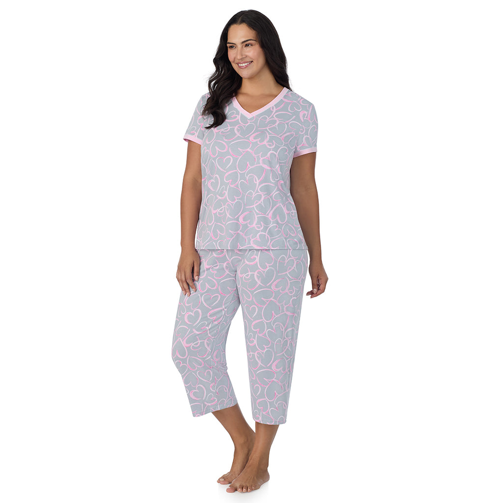 Grey Scribble Hearts;Model is wearing size 1X. She is 5'10", Bust 40", Waist 33", Hips 47".@A lady wearing Grey Scribble Hearts Cotton-Blend Short Sleeve Top with Cropped Pant 2-Pc Pajama Set PLUS!57% Cotton, 38% Modal, 5% Spandex!