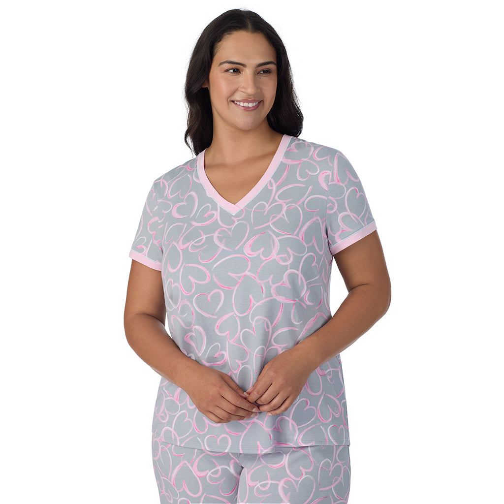 A lady wearing Grey Scribble Hearts Cotton-Blend Short Sleeve Top with Cropped Pant 2-Pc Pajama Set PLUS 