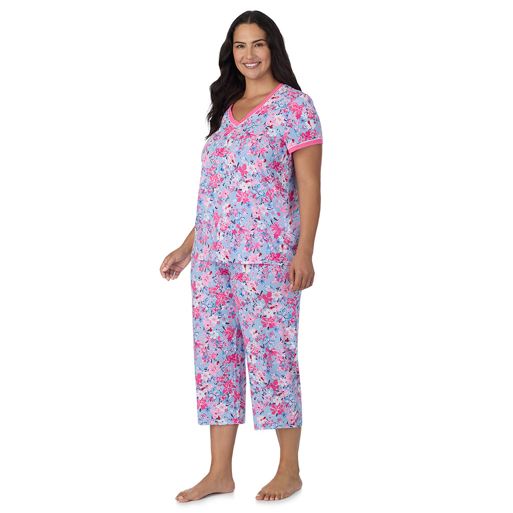 Blue Multi Floral;Model is wearing size 1X. She is 5'10", Bust 40", Waist 33", Hips 47".@A lady wearing Blue Multi Floral Cotton-Blend Short Sleeve Top with Cropped Pant 2-Pc Pajama Set PLUS !57% Cotton, 38% Modal, 5% Spandex!