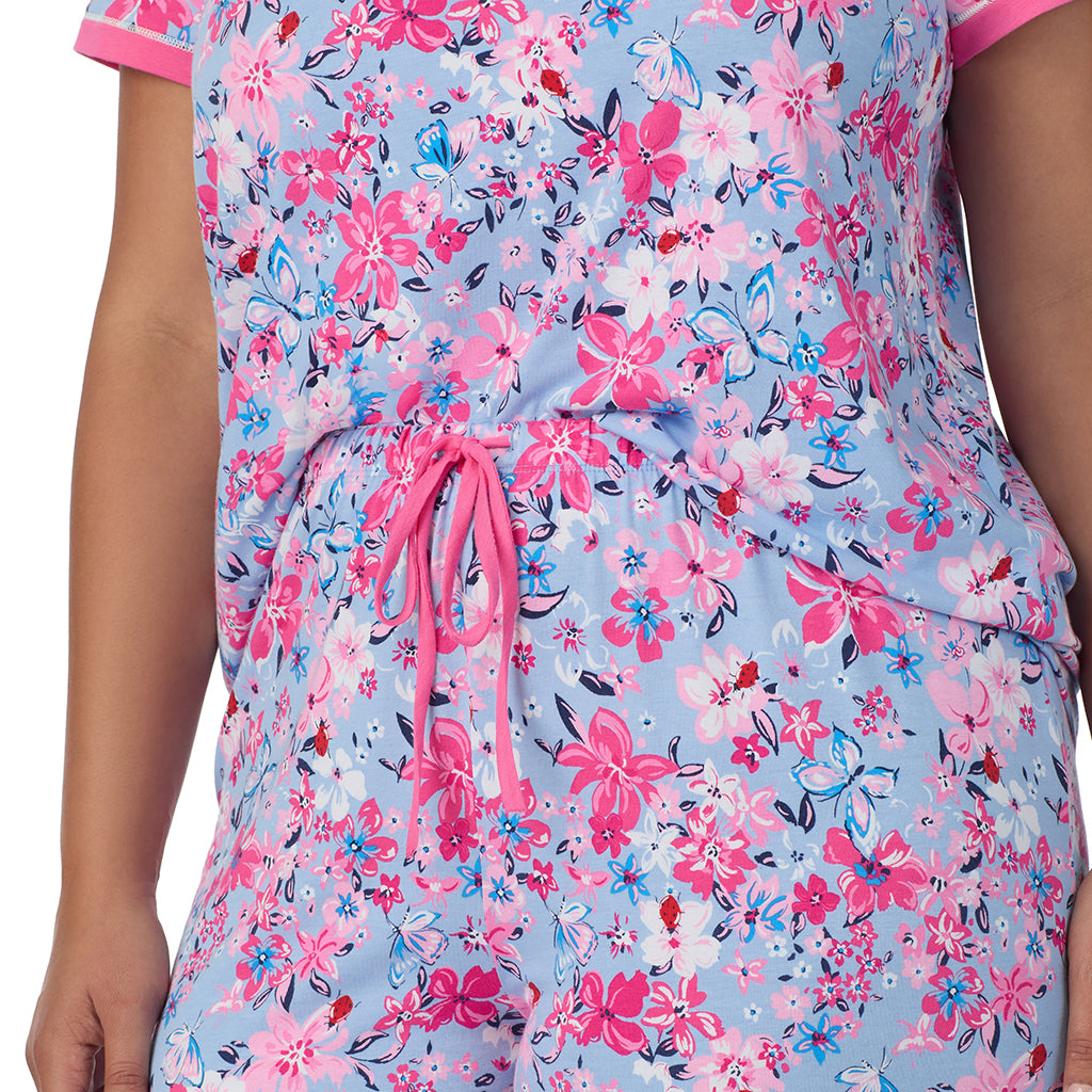 A lady wearing Blue Multi Floral Cotton-Blend Short Sleeve Top with Cropped Pant 2-Pc Pajama Set PLUS 