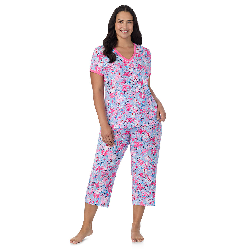 Blue Multi Floral;Model is wearing size 1X. She is 5'10", Bust 40", Waist 33", Hips 47".@A lady wearing Blue Multi Floral Cotton-Blend Short Sleeve Top with Cropped Pant 2-Pc Pajama Set PLUS !57% Cotton, 38% Modal, 5% Spandex!