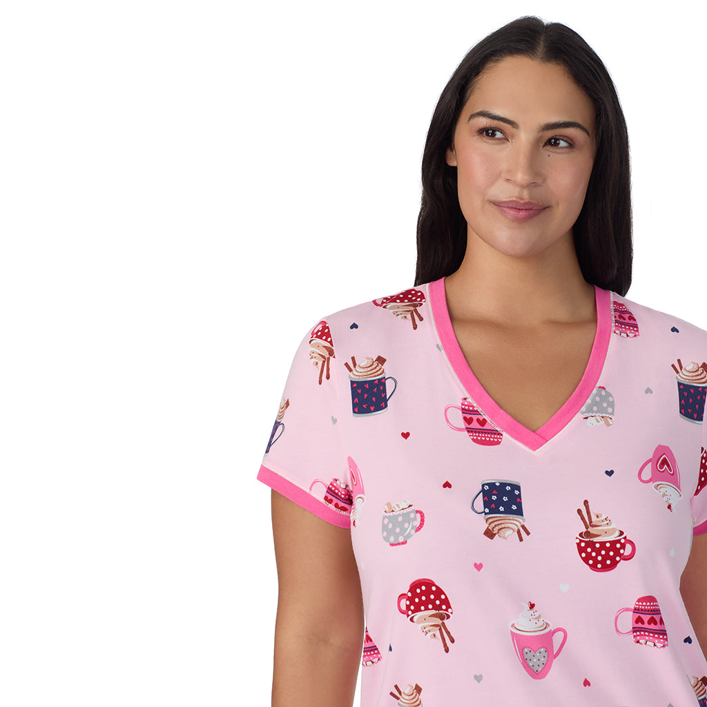 Pink Latte;Model is wearing size 1X. She is 5'10", Bust 40", Waist 33", Hips 47".@A lady wearing Pink Latte Cotton-Blend Short Sleeve Top with Cropped Pant 2-Pc Pajama Set PLUS !57% Cotton, 38% Modal, 5% Spandex!