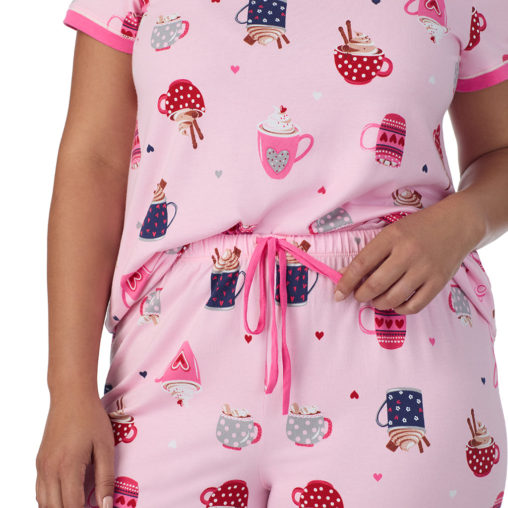 A lady wearing Pink Latte Cotton-Blend Short Sleeve Top with Cropped Pant 2-Pc Pajama Set PLUS 