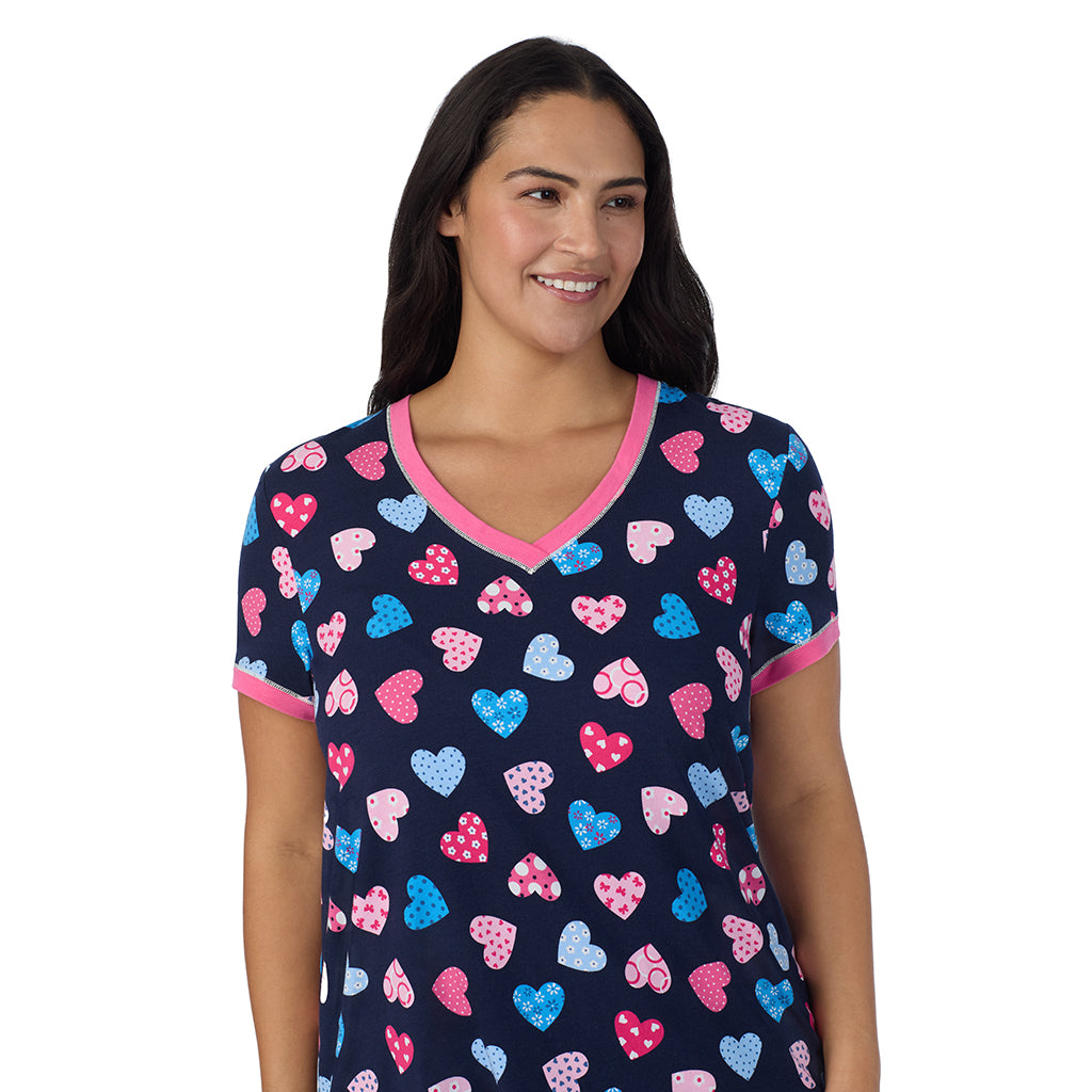 Navy Multi Hearts;Model is wearing size 1X. She is 5'10", Bust 40", Waist 33", Hips 47".@A lady wearing Navy Multi Hearts Cotton-Blend Short Sleeve Top with Cropped Pant 2-Pc Pajama Set PLUS !57% Cotton, 38% Modal, 5% Spandex!