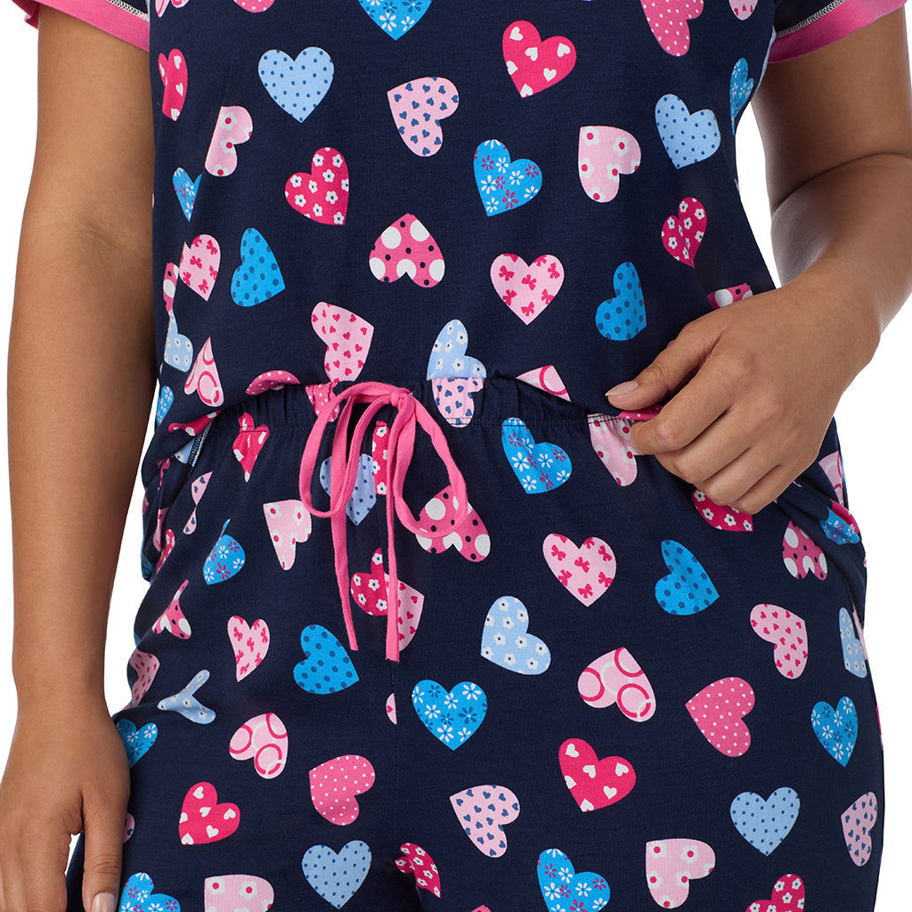 Navy Multi Hearts;Model is wearing size 1X. She is 5'10", Bust 40", Waist 33", Hips 47".@A lady wearing Navy Multi Hearts Cotton-Blend Short Sleeve Top with Cropped Pant 2-Pc Pajama Set PLUS !57% Cotton, 38% Modal, 5% Spandex!