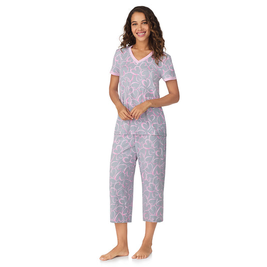 A lady wearing Grey Scribble Hearts Cotton-Blend Short Sleeve Top with Cropped Pant 2-Pc Pajama Set 