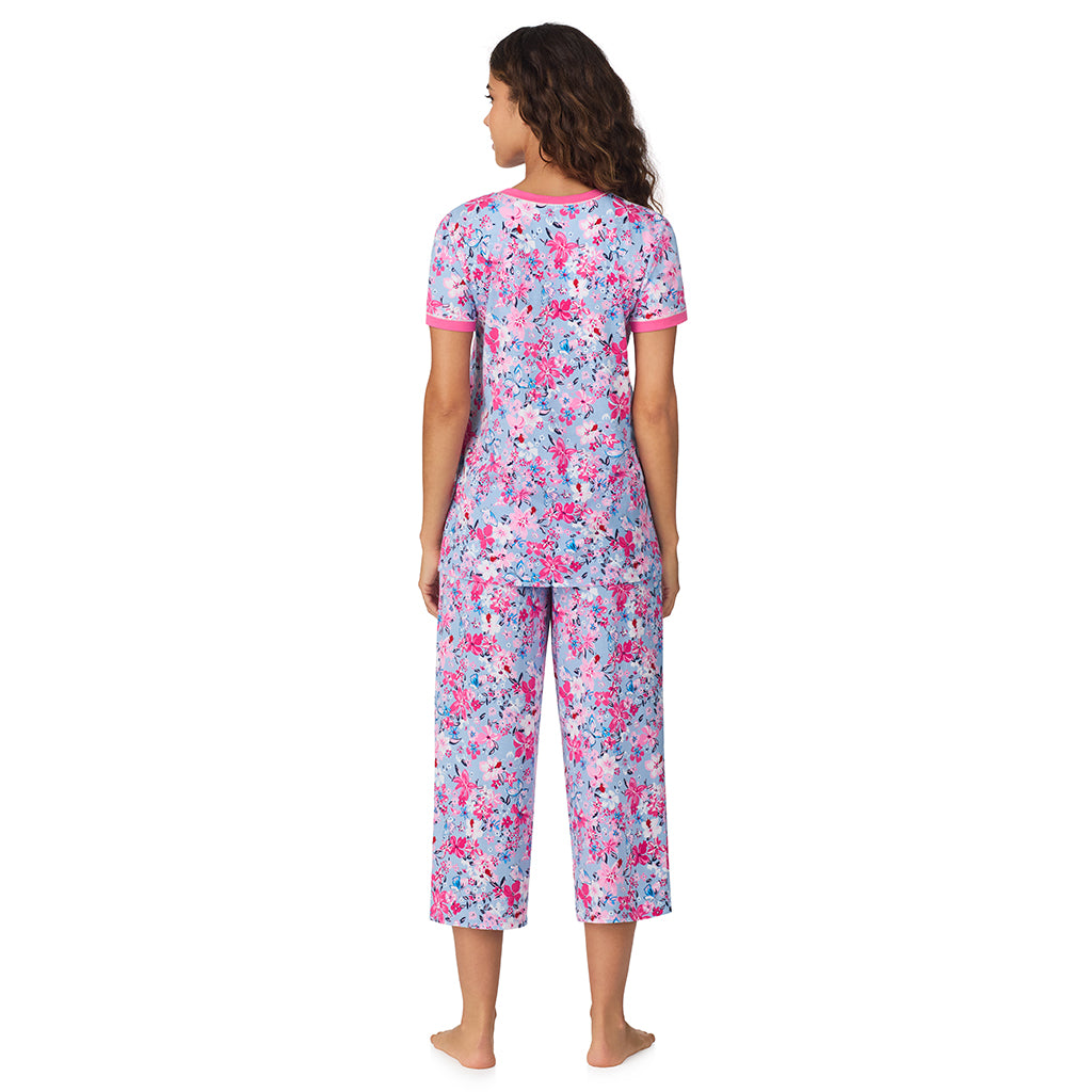 Blue Multi Floral;Model is wearing size S. She is 5’9”, Bust 34”, Waist 23”, Hips 35”.@A lady wearing Blue Multi Floral Cotton-Blend Short Sleeve Top with Cropped Pant 2-Pc Pajama Set !57% Cotton, 38% Modal, 5% Spandex!