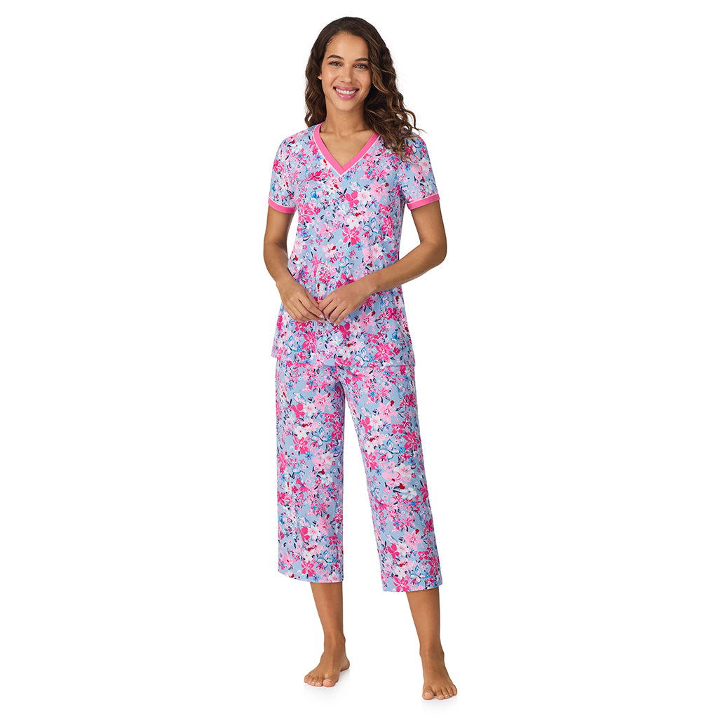 A lady wearing Blue Multi Floral Cotton-Blend Short Sleeve Top with Cropped Pant 2-Pc Pajama Set 