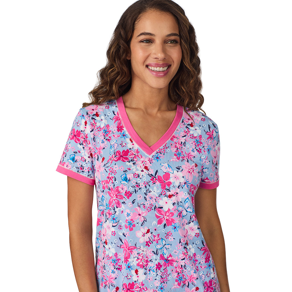 A lady wearing Blue Multi Floral Cotton-Blend Short Sleeve Top with Cropped Pant 2-Pc Pajama Set 