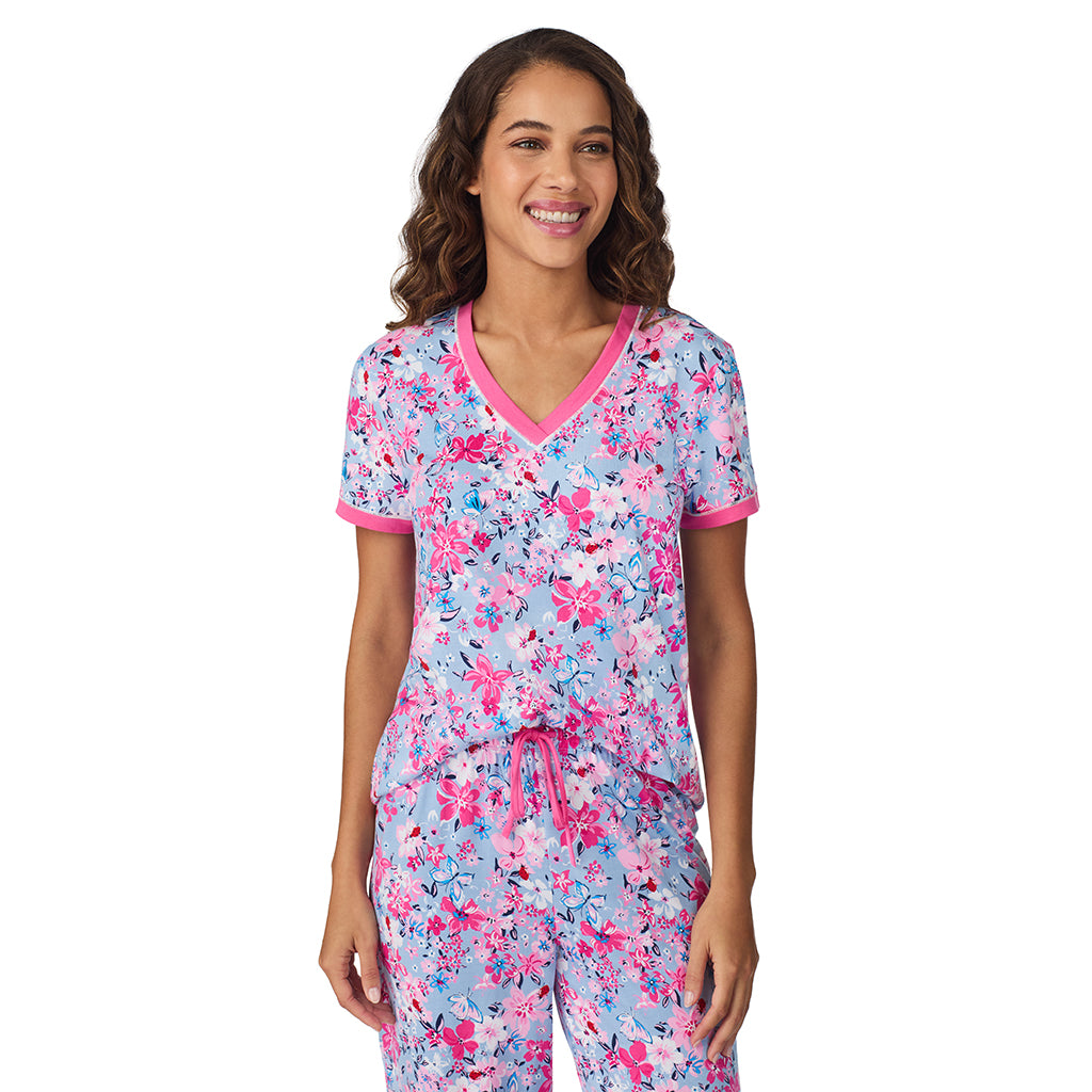 A lady wearing Blue Multi Floral Cotton-Blend Short Sleeve Top with Cropped Pant 2-Pc Pajama Set 