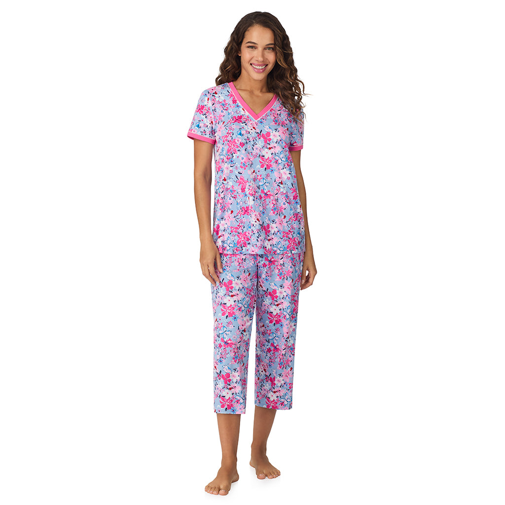 A lady wearing Blue Multi Floral Cotton-Blend Short Sleeve Top with Cropped Pant 2-Pc Pajama Set 