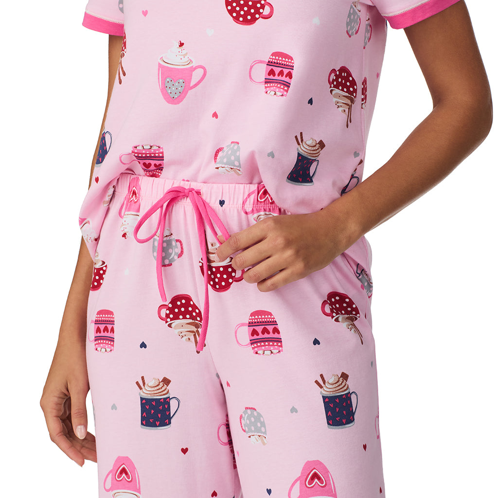 Pink Latte;Model is wearing size S. She is 5’9”, Bust 34”, Waist 23”, Hips 35”.@A lady wearing Pink Latte Cotton-Blend Short Sleeve Top with Cropped Pant 2-Pc Pajama Set !57% Cotton, 38% Modal, 5% Spandex!