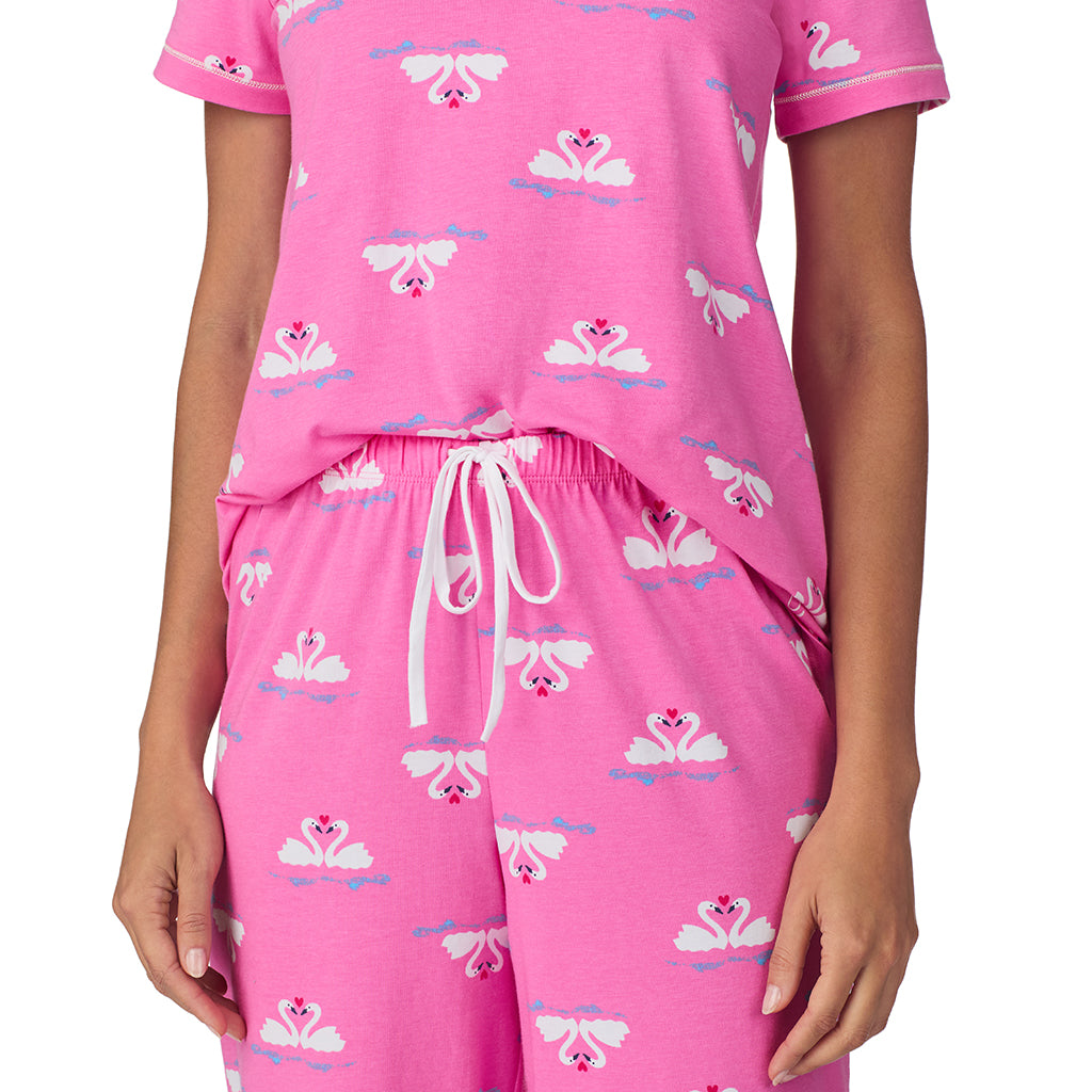 Pink Swans;Model is wearing size S. She is 5’9”, Bust 34”, Waist 23”, Hips 35”.@A lady wearing Pink Swans Cotton-Blend Short Sleeve Top with Cropped Pant 2-Pc Pajama Set !57% Cotton, 38% Modal, 5% Spandex!