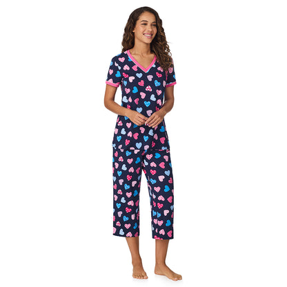 Navy Multi Hearts;Model is wearing size S. She is 5’9”, Bust 34”, Waist 23”, Hips 35”.@A lady wearing Navy Multi Hearts Cotton-Blend Short Sleeve Top with Cropped Pant 2-Pc Pajama Set !57% Cotton, 38% Modal, 5% Spandex!