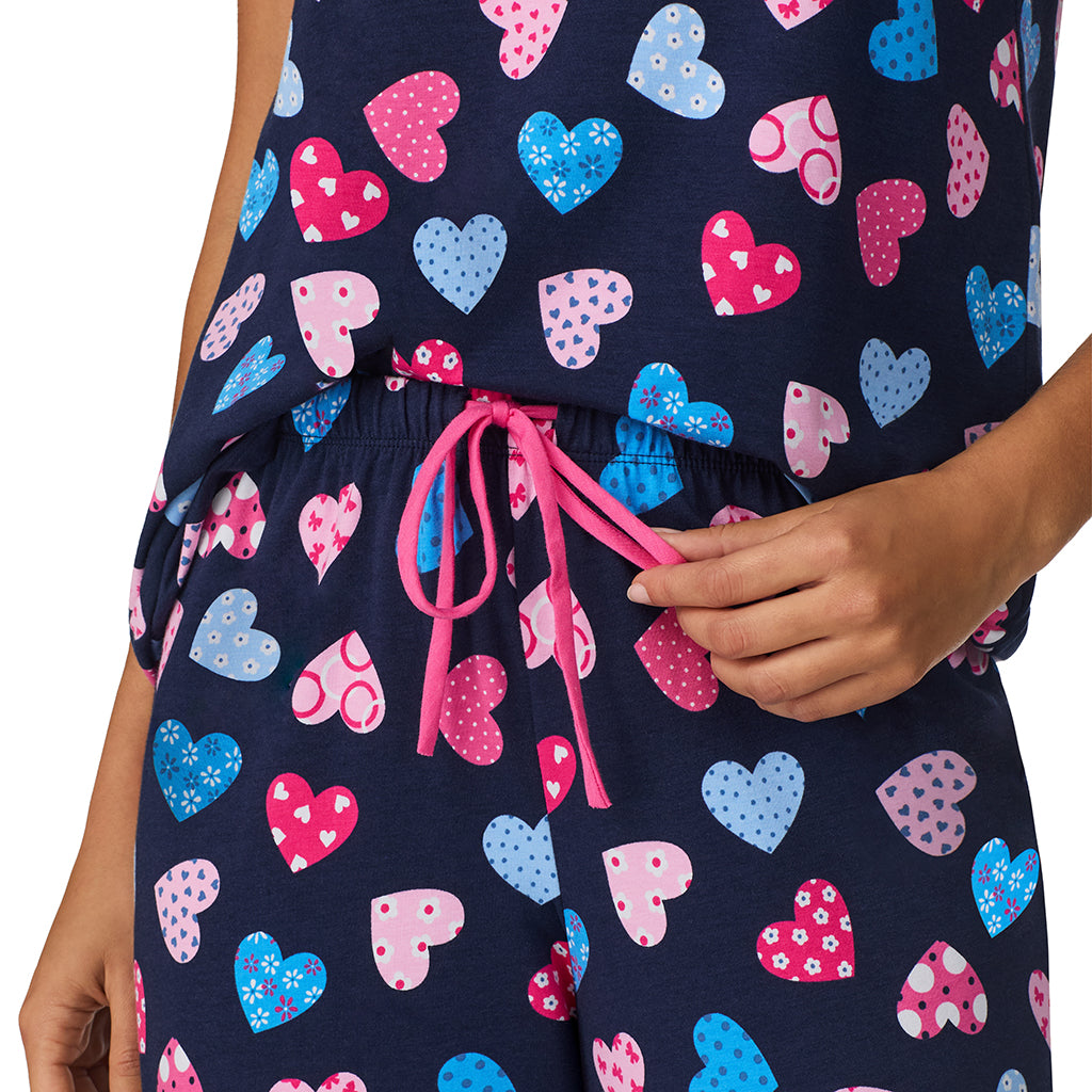 Navy Multi Hearts;Model is wearing size S. She is 5’9”, Bust 34”, Waist 23”, Hips 35”.@A lady wearing Navy Multi Hearts Cotton-Blend Short Sleeve Top with Cropped Pant 2-Pc Pajama Set !57% Cotton, 38% Modal, 5% Spandex!