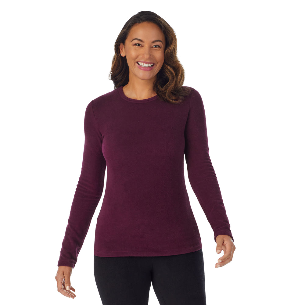 upper body of A lady wearing Purple Beet Long Sleeve Crew !59% Polyester, 35% Recycled Polyester, 6% Spandex!