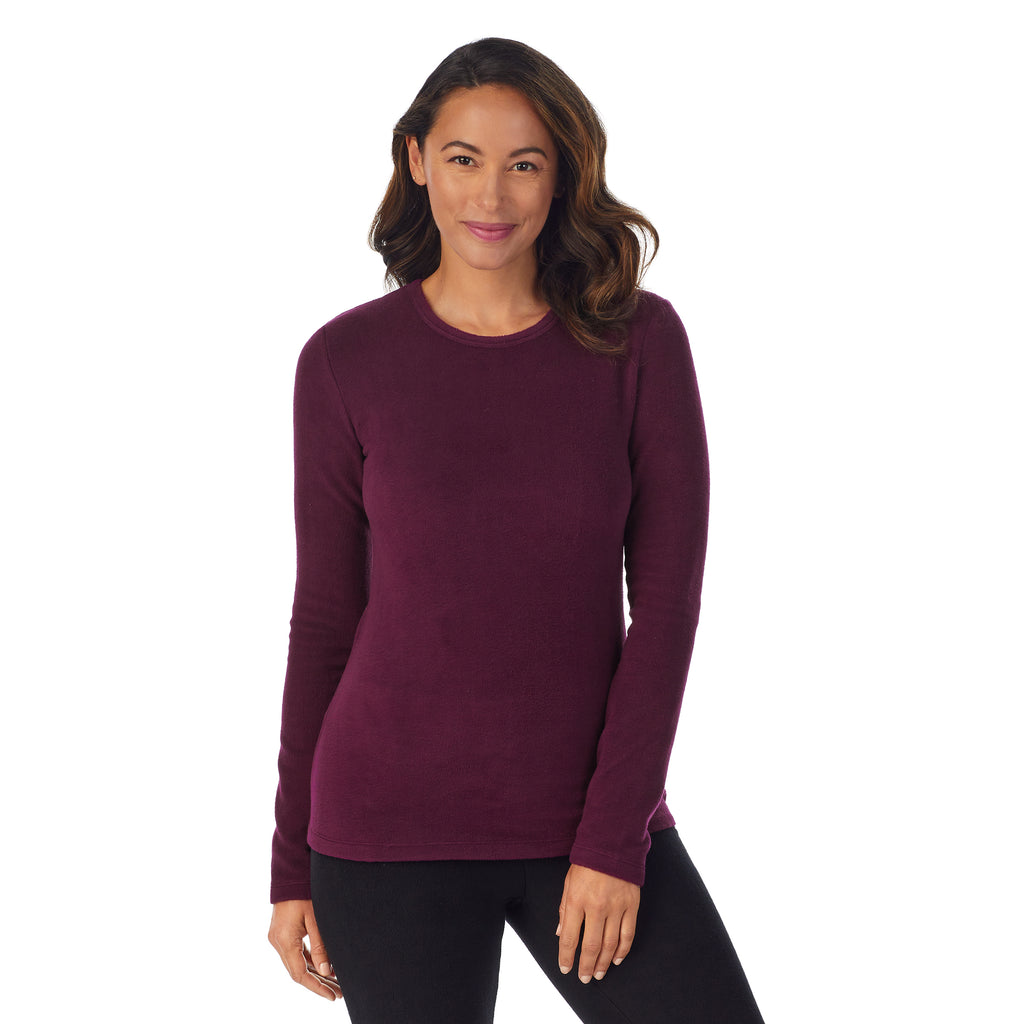 upper body of A lady wearing Purple Beet Long Sleeve Crew !59% Polyester, 35% Recycled Polyester, 6% Spandex!