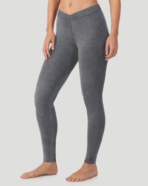 A lady wearing a ivory stretch legging petite.