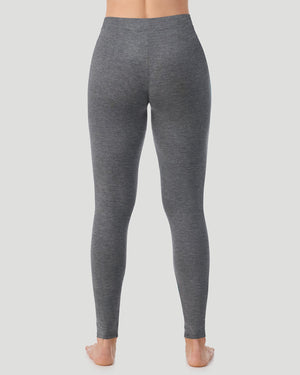 A lady wearing a black stretch legging petite.