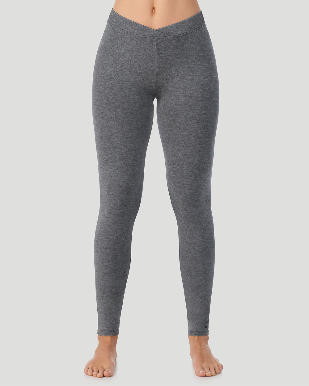 A lady wearing a black stretch legging petite.