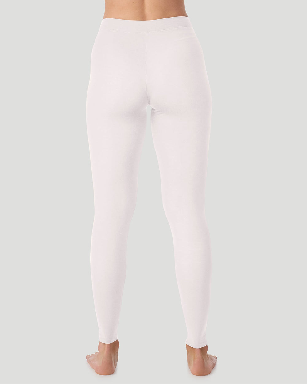 A lady wearing a charcoal heather stretch legging plus.