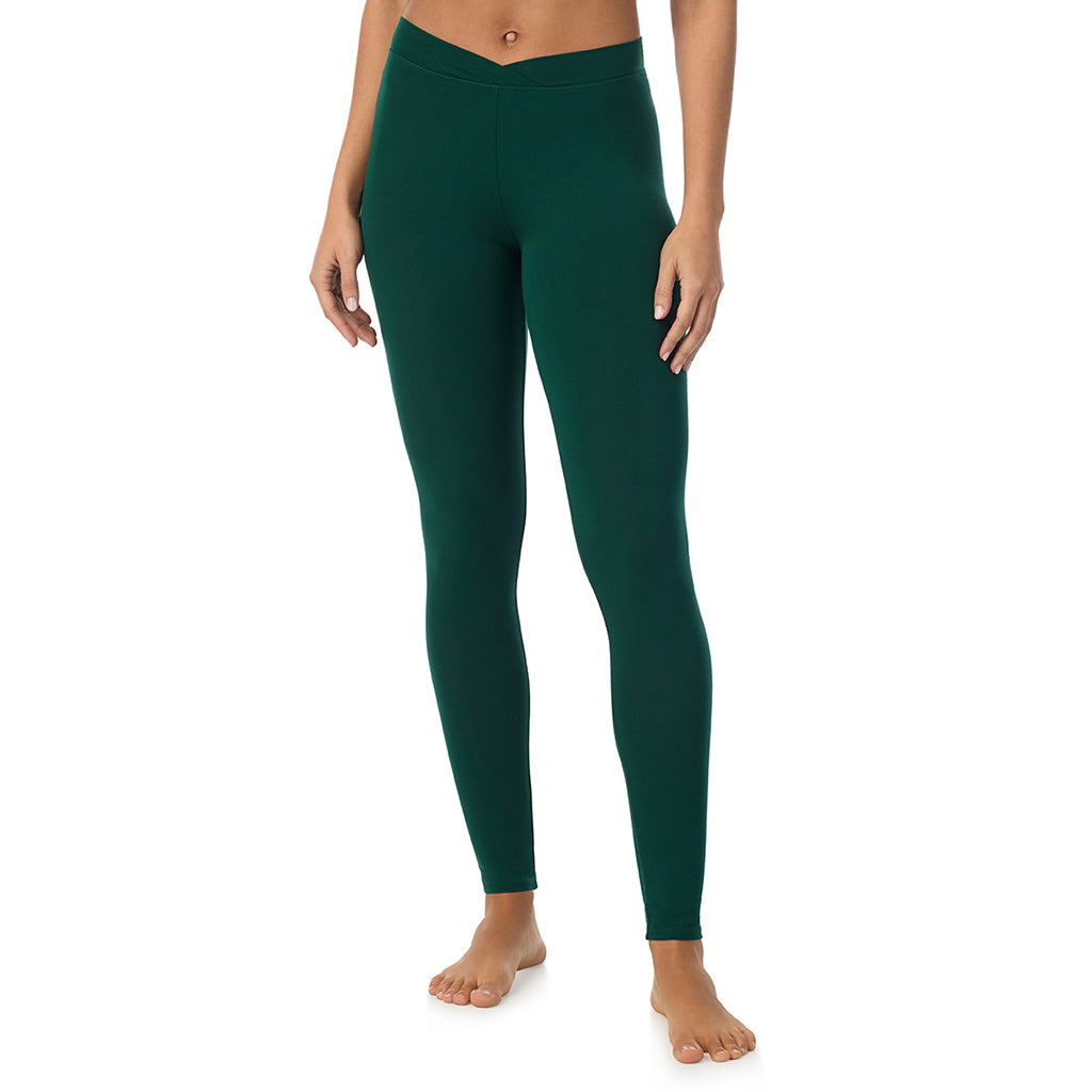 A lady wearing a evergreen stretch legging tall.