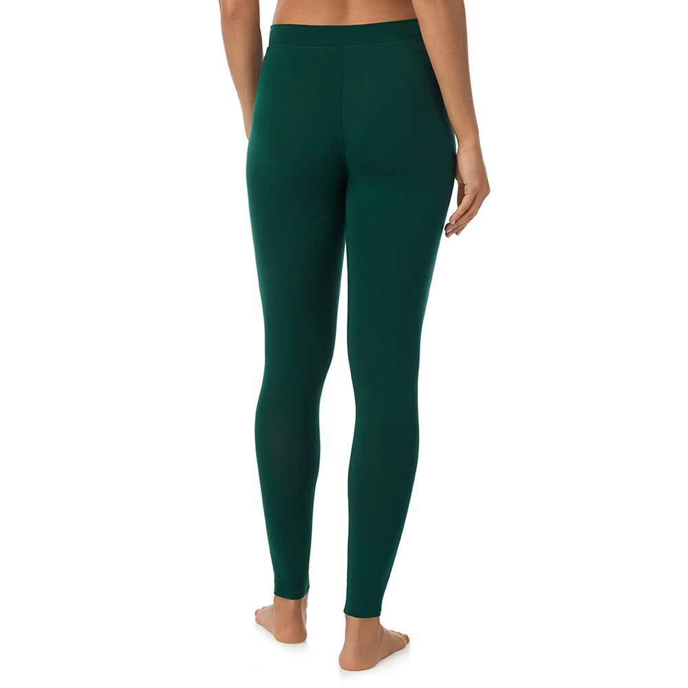 A lady wearing a evergreen stretch legging tall.