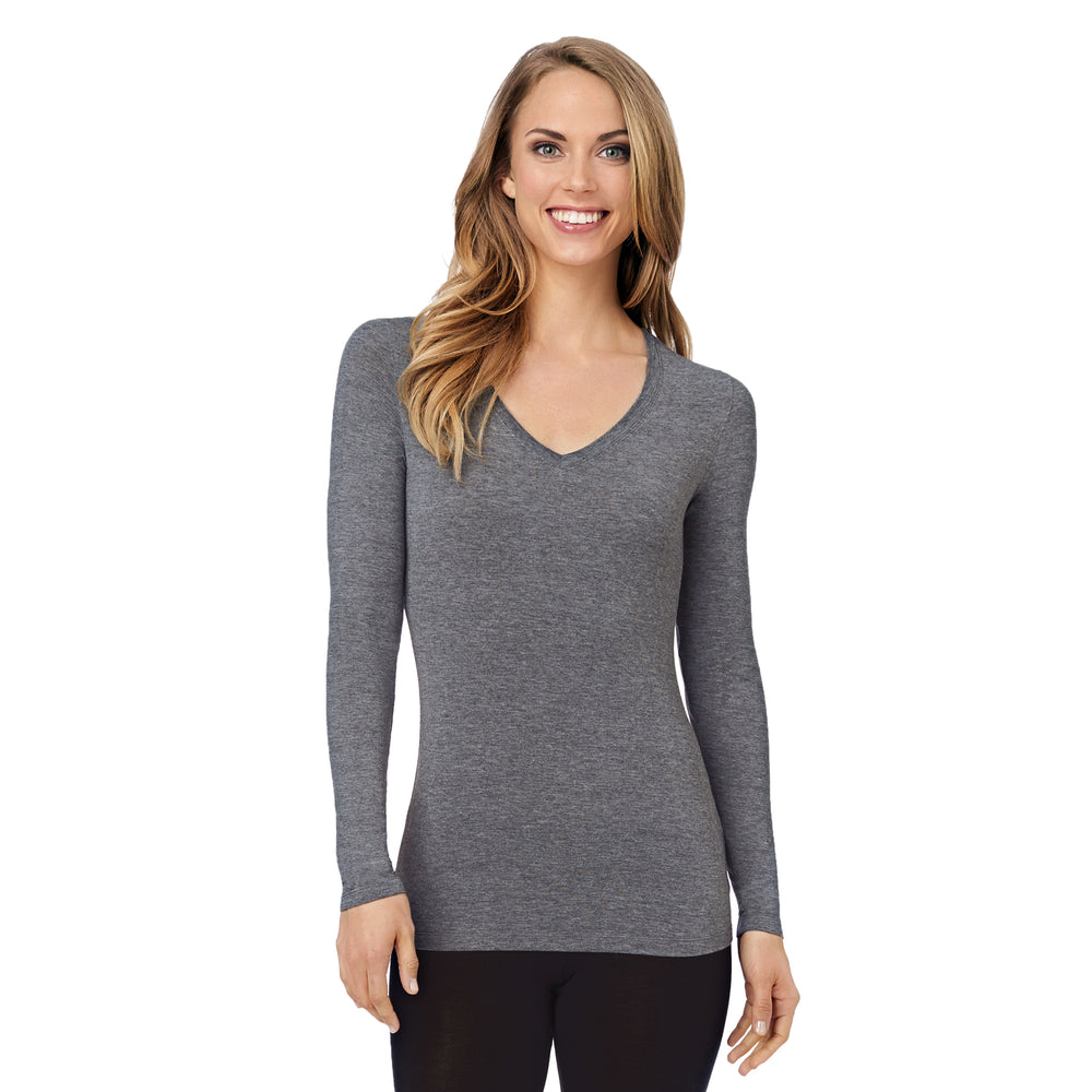 A lady wearing charcoal heather long sleeve v-neck tall softwear with stretch top.