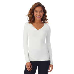 A lady wearing ivory long sleeve v-neck tall softwear with stretch top.